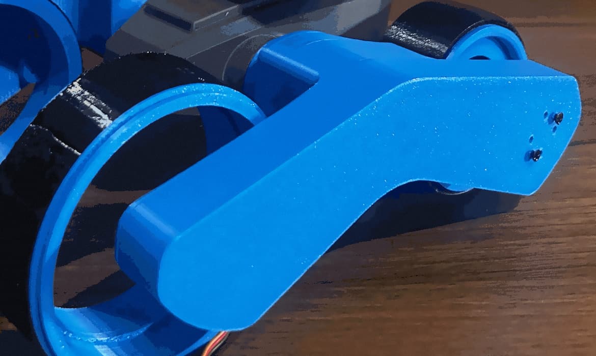 Close-up of a 3D-printed wheel ring, tyre and side arm